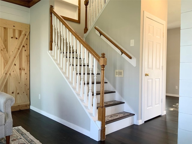 staircase featuring hardwood / wood-style flooring