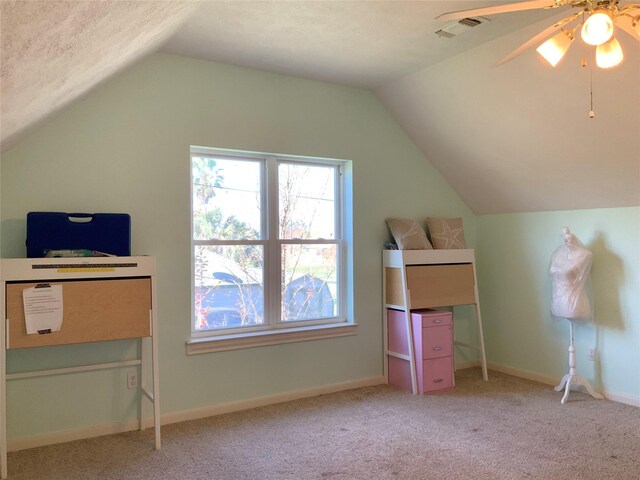 bonus room featuring ceiling fan, light carpet, and vaulted ceiling