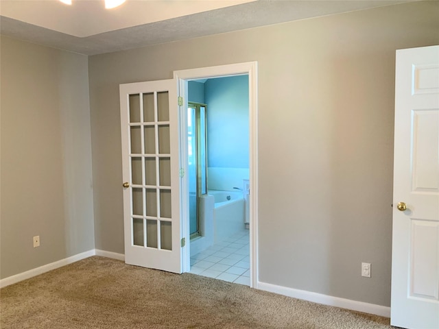 empty room featuring light colored carpet