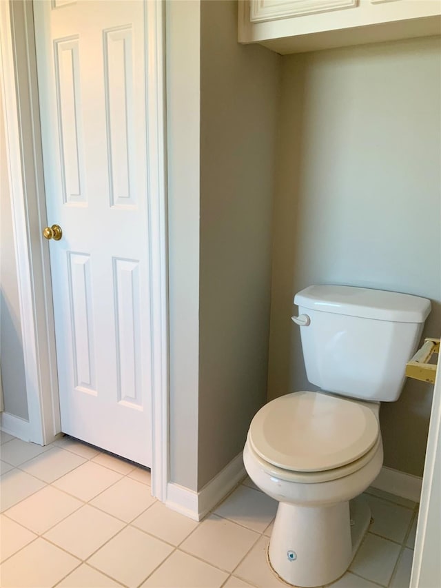 bathroom featuring tile patterned flooring and toilet