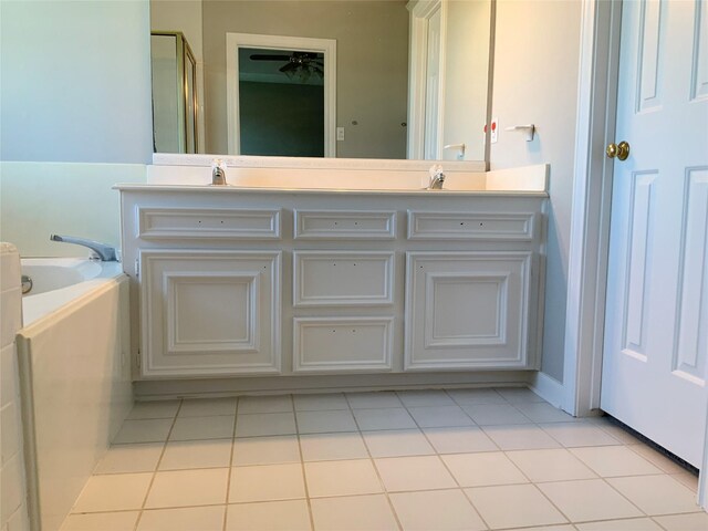 bathroom with plus walk in shower, vanity, and tile patterned floors