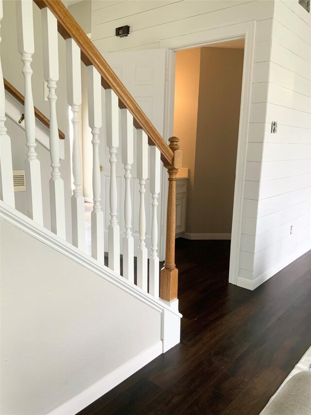 staircase featuring hardwood / wood-style flooring