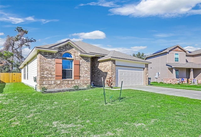 view of front of house with a garage and a front lawn