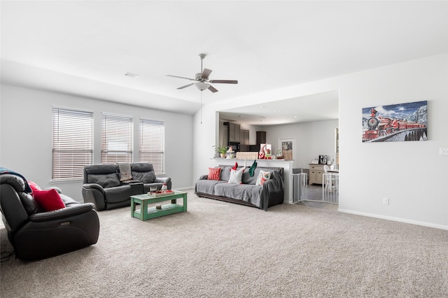 living room with ceiling fan and carpet floors