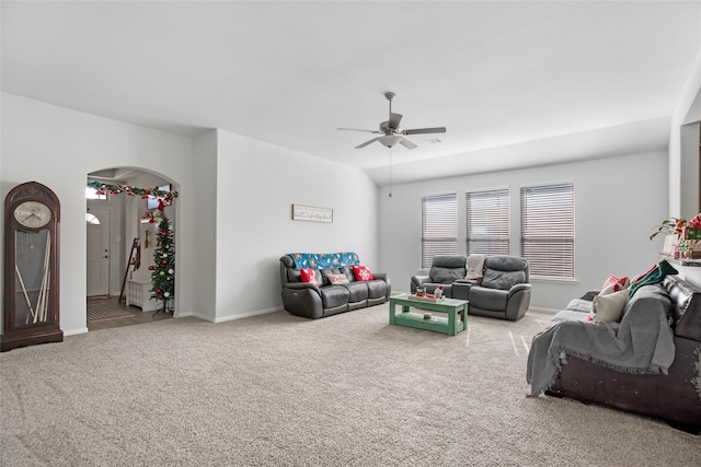 carpeted living room featuring ceiling fan