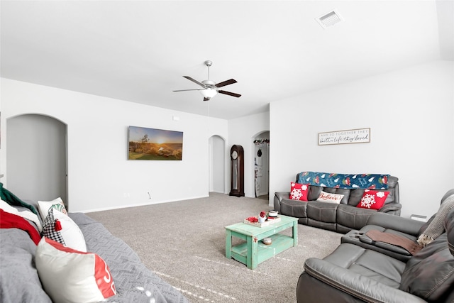 carpeted living room with ceiling fan