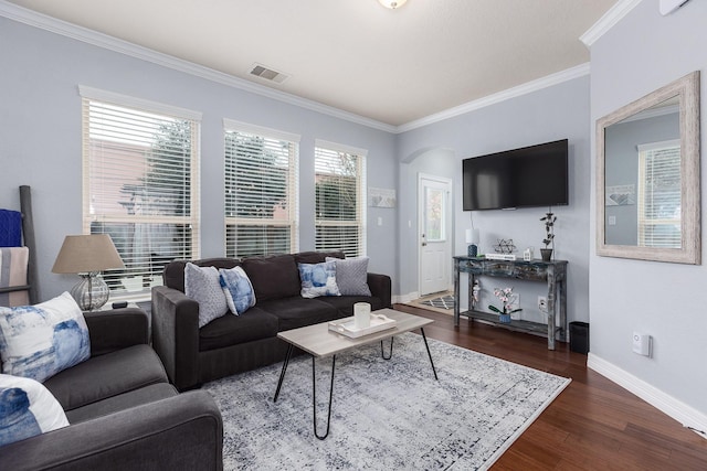 living room featuring dark hardwood / wood-style floors and ornamental molding