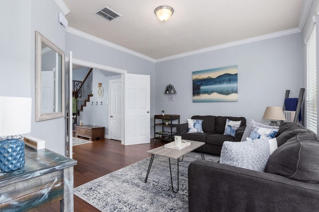 living room with dark hardwood / wood-style floors and crown molding