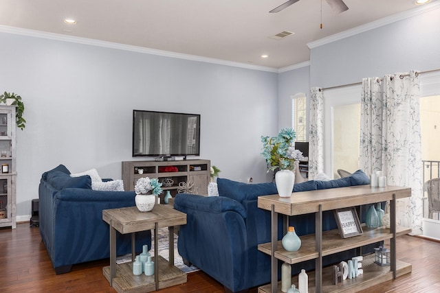 living room featuring dark wood-type flooring and ornamental molding