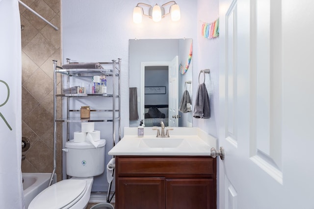 full bathroom with vanity, toilet, and tiled shower / bath combo