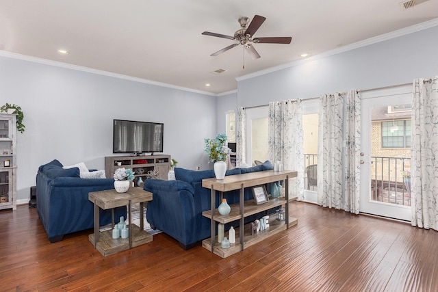 living room with dark hardwood / wood-style floors, ceiling fan, and ornamental molding