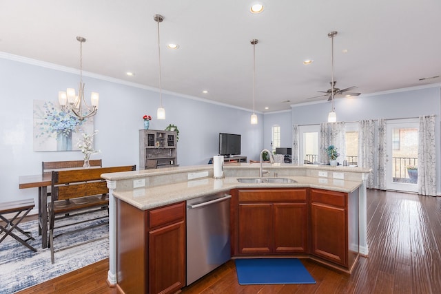 kitchen featuring a kitchen island with sink, ceiling fan with notable chandelier, sink, stainless steel dishwasher, and ornamental molding