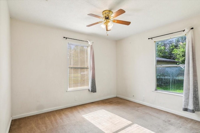 carpeted empty room with ceiling fan