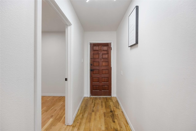 corridor featuring light hardwood / wood-style flooring