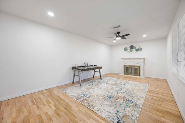 interior space with ceiling fan and hardwood / wood-style flooring