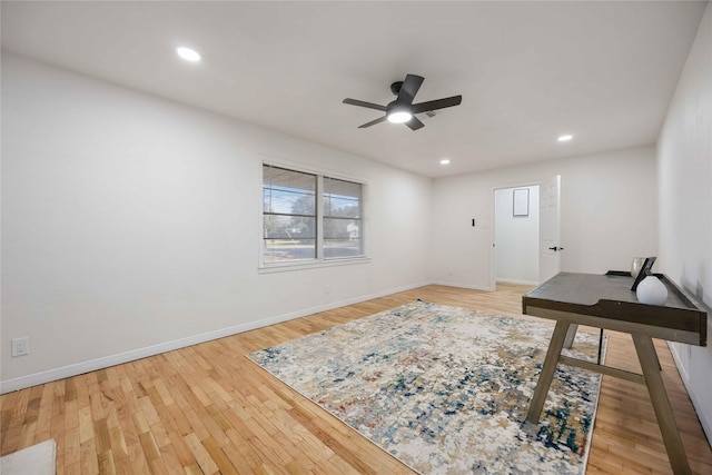 home office featuring hardwood / wood-style floors and ceiling fan