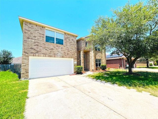 view of front of property with a front yard and a garage