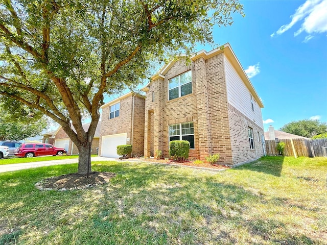 view of front of home with a front lawn and a garage