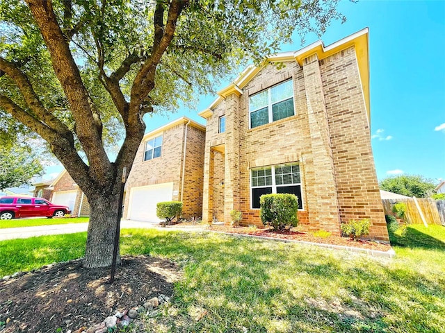 view of front facade with a front yard and a garage