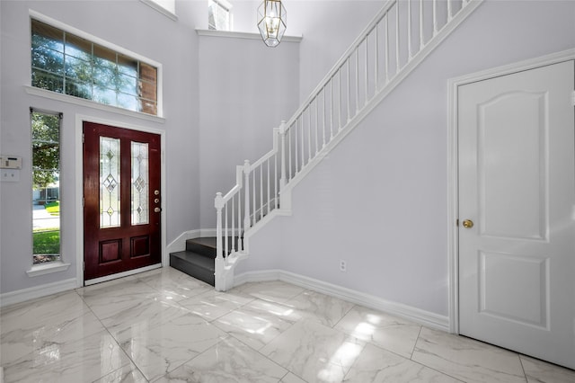 foyer featuring a high ceiling