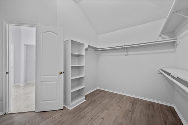 spacious closet with vaulted ceiling