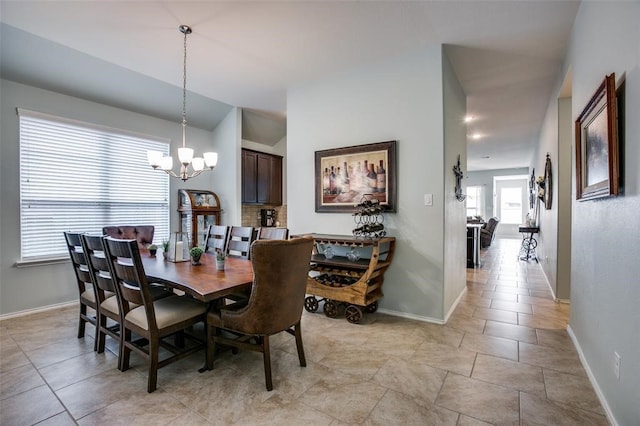 dining space featuring a chandelier