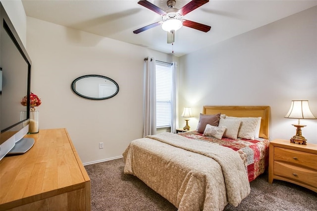 bedroom featuring dark colored carpet and ceiling fan