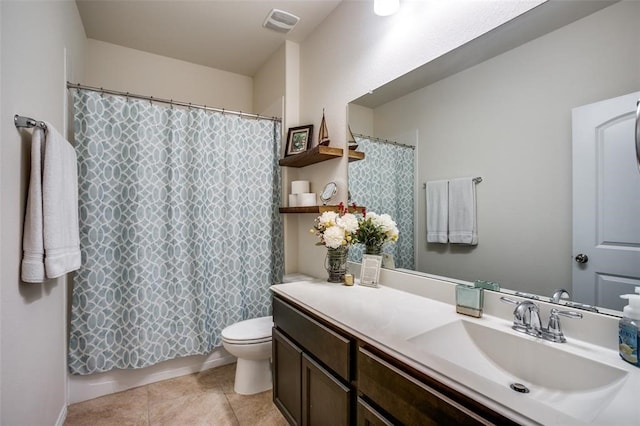 bathroom featuring toilet, vanity, tile patterned floors, and walk in shower