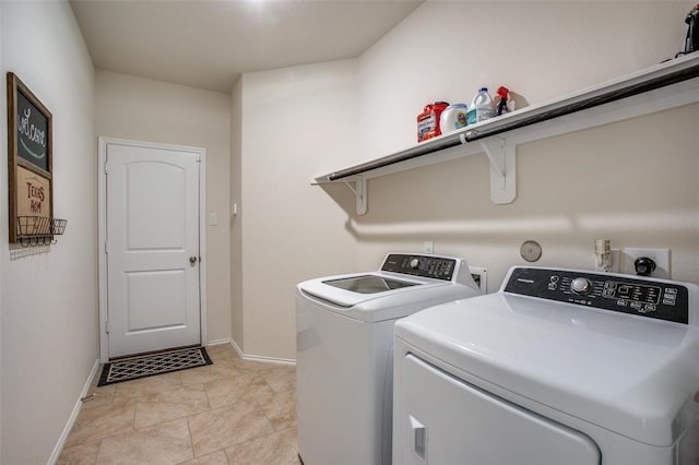 washroom featuring washing machine and clothes dryer