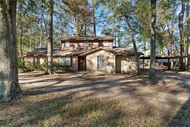 view of front of property featuring a carport