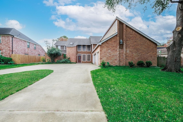 front facade featuring a front yard and a garage