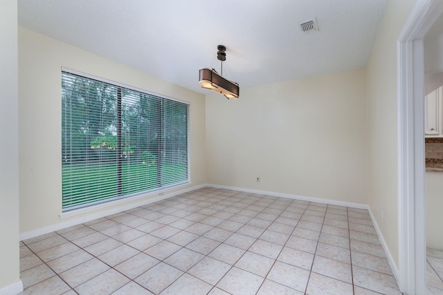 unfurnished dining area with plenty of natural light and light tile patterned flooring