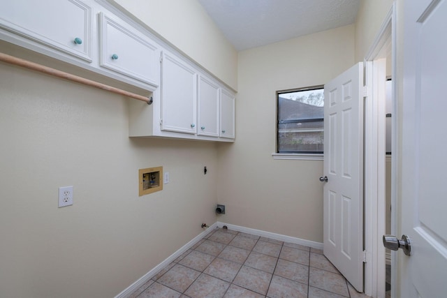 laundry room featuring cabinets, electric dryer hookup, hookup for a gas dryer, hookup for a washing machine, and light tile patterned floors