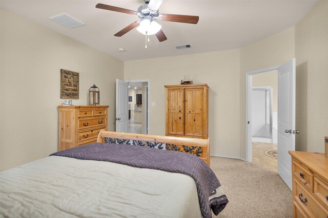 bedroom with ceiling fan and light carpet