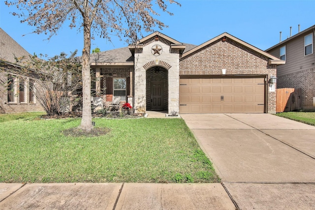 view of front of property featuring a front yard and a garage