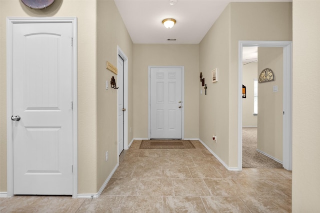 8458 Coral Cove Pass Ln, Conroe, TX 77304 - entryway featuring baseboards and light tile patterned floors