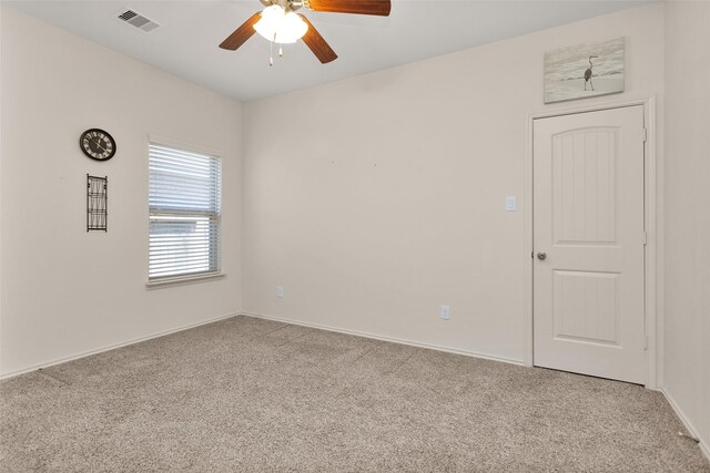 8458 Coral Cove Pass Ln, Conroe, TX 77304 - unfurnished room featuring carpet, ceiling fan, and baseboards