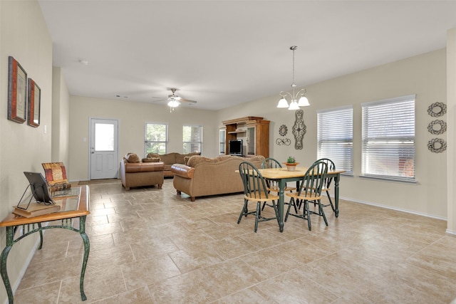 8458 Coral Cove Pass Ln, Conroe, TX 77304 - dining room with ceiling fan, baseboards, and a chandelier