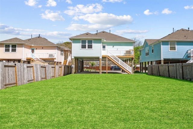 347 Bay Oaks St, La Porte, TX 77571 - back of house with stairs, a fenced backyard, and a shingled roof