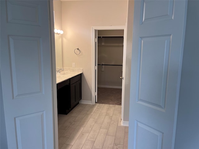 bathroom featuring vanity and hardwood / wood-style floors