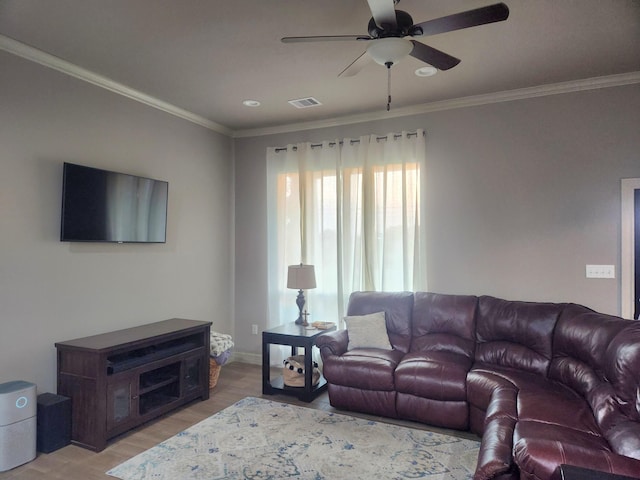 living room with ceiling fan, light hardwood / wood-style floors, and ornamental molding