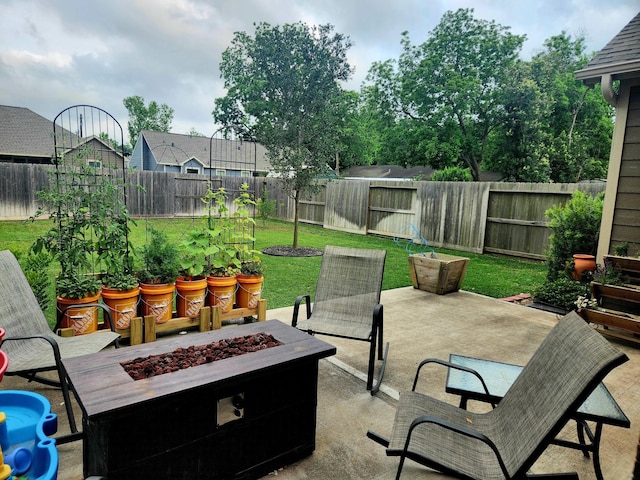 view of patio / terrace with a fire pit