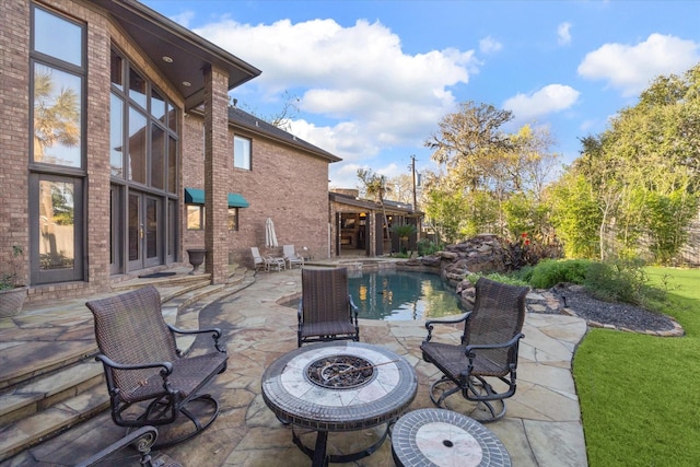 view of patio / terrace with an outdoor fire pit