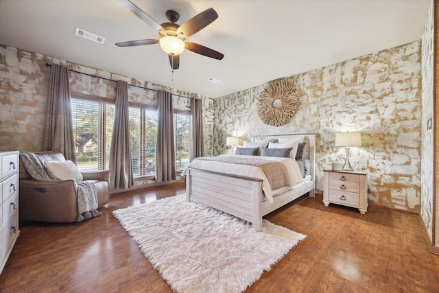 bedroom featuring ceiling fan and dark hardwood / wood-style flooring