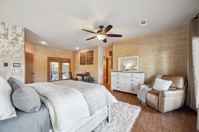 bedroom with access to exterior, french doors, ceiling fan, and dark wood-type flooring