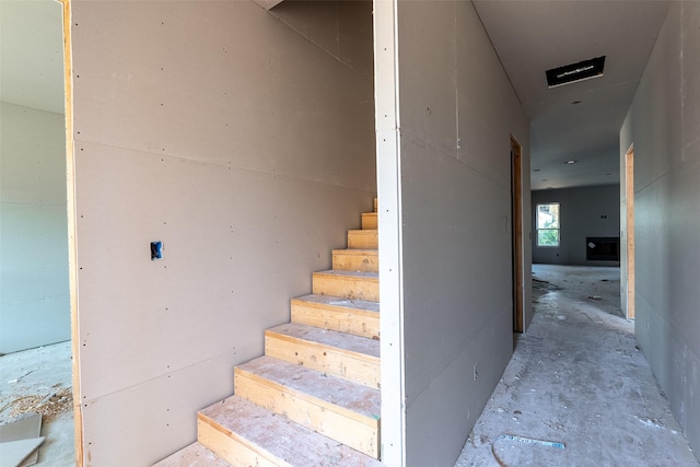 stairs with concrete floors