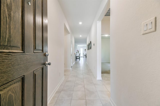 corridor with light tile patterned flooring