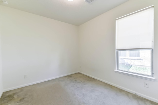 empty room featuring light colored carpet