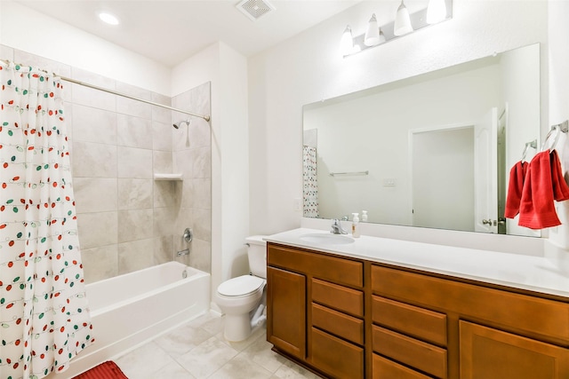 full bathroom featuring tile patterned flooring, shower / bath combo with shower curtain, vanity, and toilet