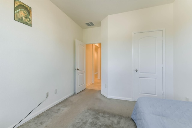 bedroom with light carpet